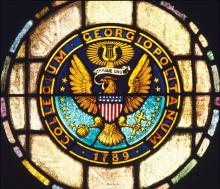 The Georgetown University seal rendered in stained glass