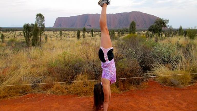 Student in front of Ayers Rock