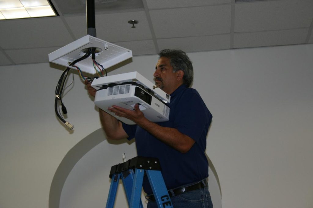 CETS staff installing new projectors