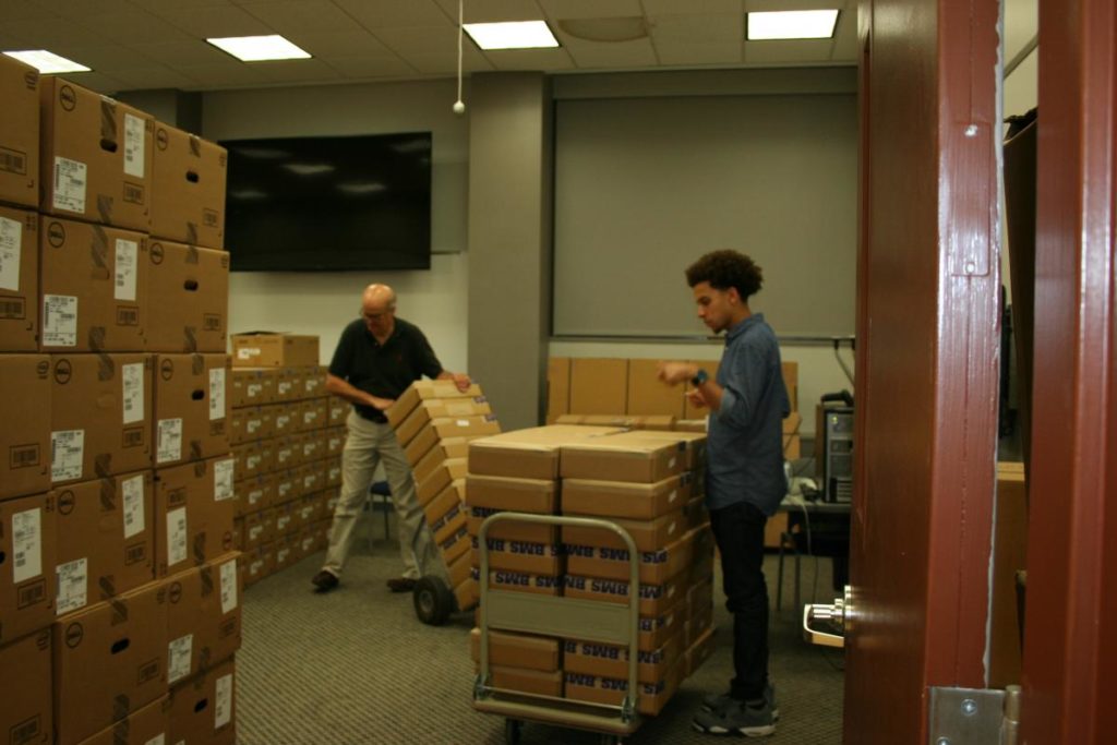 Workers receiving new inventory