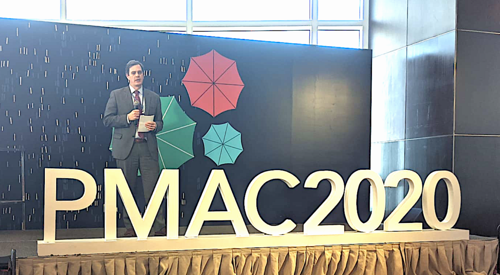 Dr. Holmes speaking on universal health care and HIV at the 2020 PMAC conference in Bangkok, Thailand 