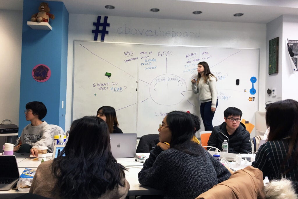 person at a whiteboard