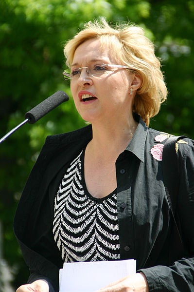 Dr. Beate Merk speaking at an event outside