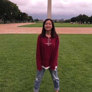 Ulie Xu standing on the National Mall in front of the Washington Monument