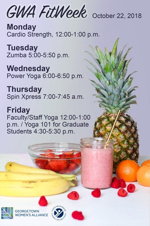 A smoothie with a pineapple, bananas, oranges, strawberries, and other berries